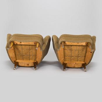 A pair of mid-20th century armchairs.