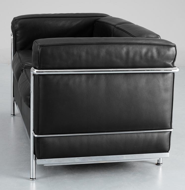 A Le Corbusier 'LC 2' two-seated black leather and chromed steel sofa, by Cassina, Italy.