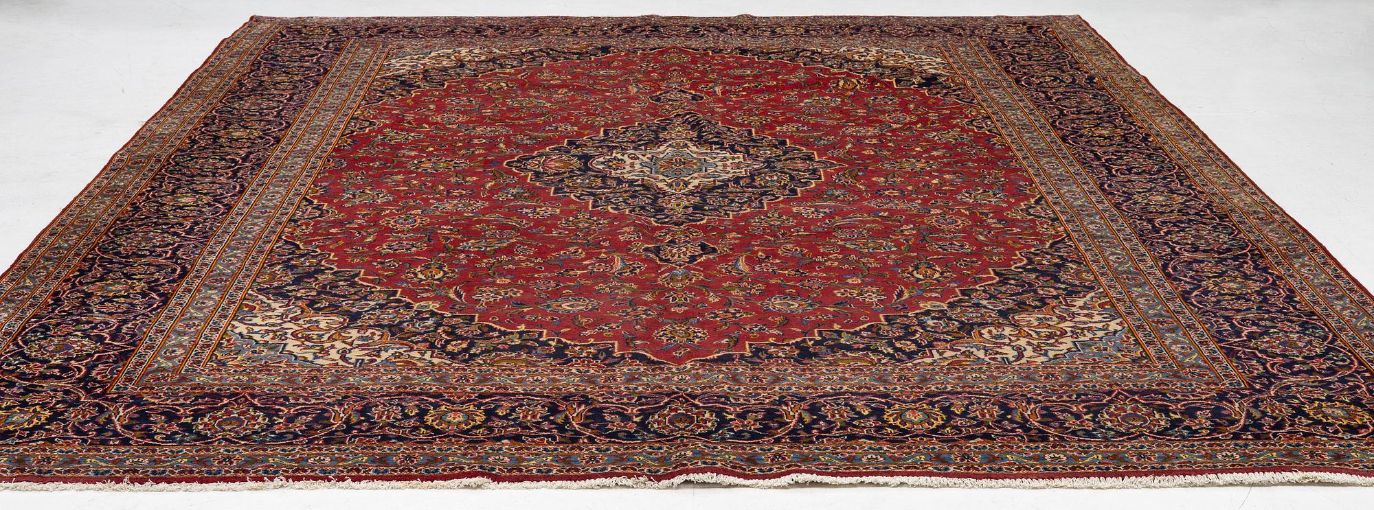 A Keshan carpet, central Iran, signed c, 392 x 301 cm.