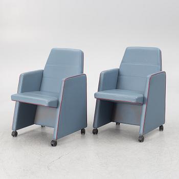 A pair of 1980s armchairs.