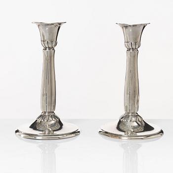 A pair of silver candle sticks, first half of the 20th century.