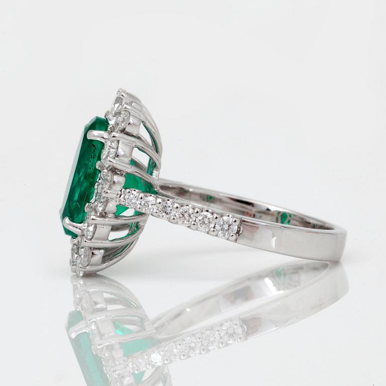 A 3.32ct Colombian emerald 'minor oil' and brilliant-cut diamond ring.