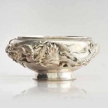 A Chinese double walled 'dragon' silver bowl, Shanghai, around 1900.