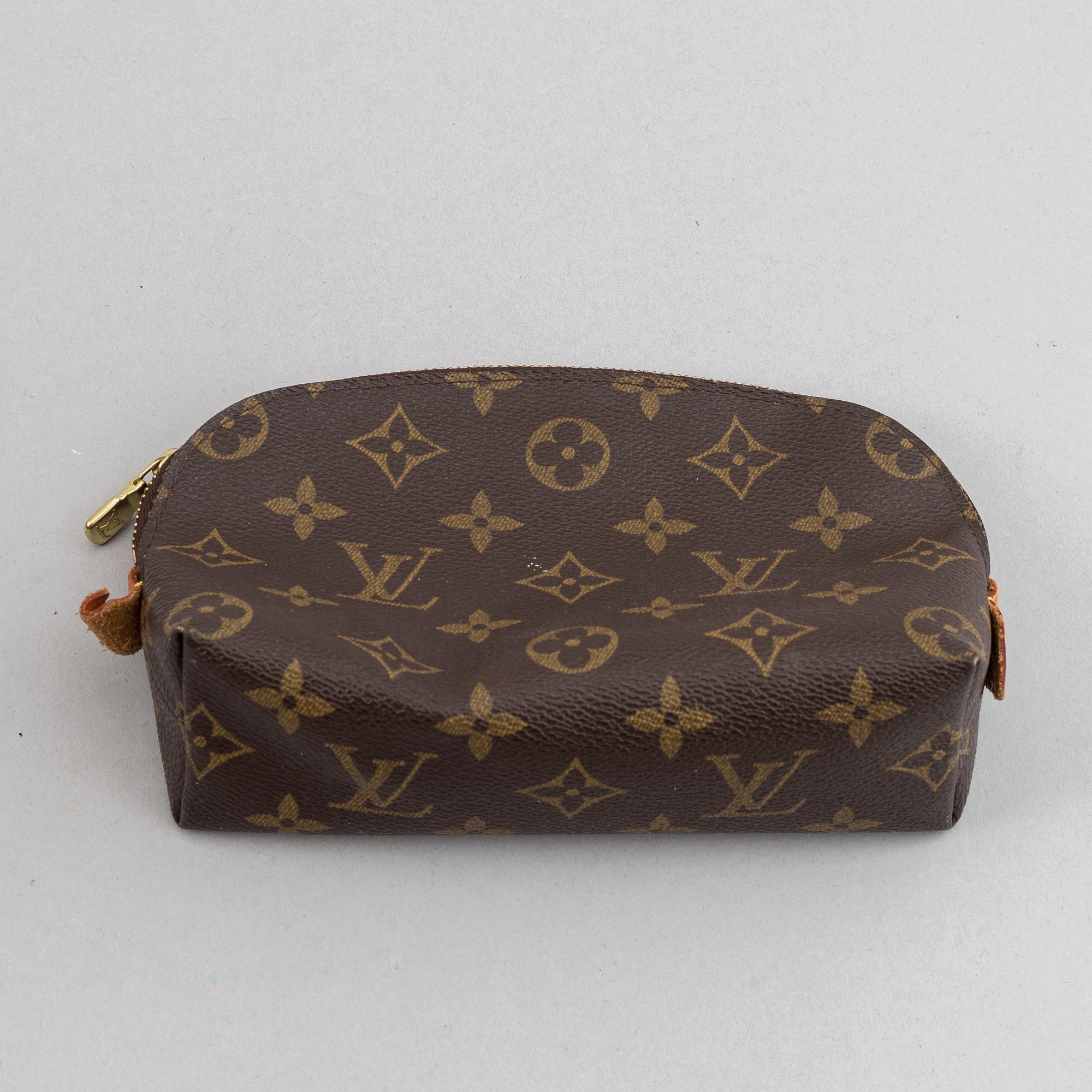 Louis Vuitton, a monogram canvas 'Keepall 55' weekend bag and toilet bag.