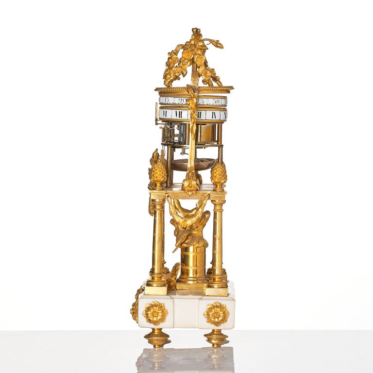 A Louis XVI marble and ormolu 'aux cercles tournants' portico mantel clock, late 18th century.