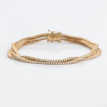 Brilliant cut diamond three strand bracelet.