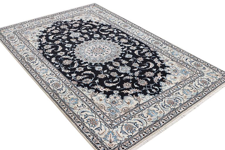 A Nain carpet, part silk, c. 286 x 206 cm.