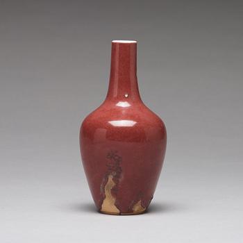 A sang de boef vase and bowl and an enamelled cup with cover and stand, Qing dynasty (1664-1912).