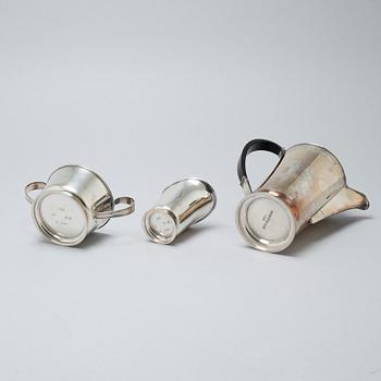 A silver coffee pot, sugar bowl and creamer by Thore Eldh for K&EC in Göteborg, 1949.