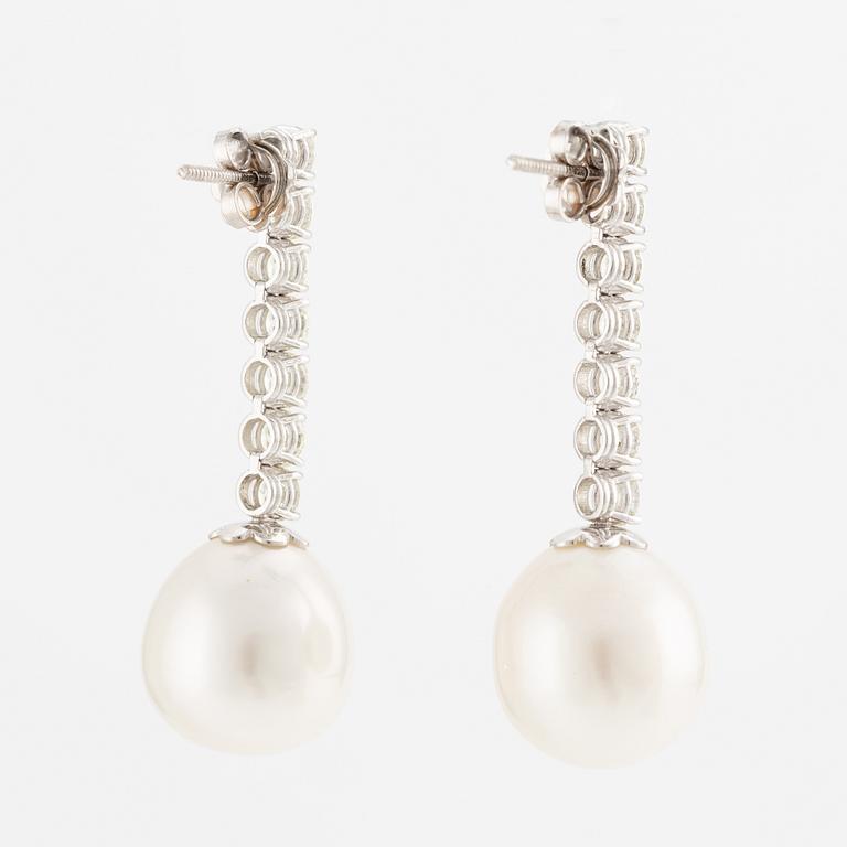 A pair of earrings in 18K white gold with cultured South Sea pearls and round brilliant-cut diamonds.