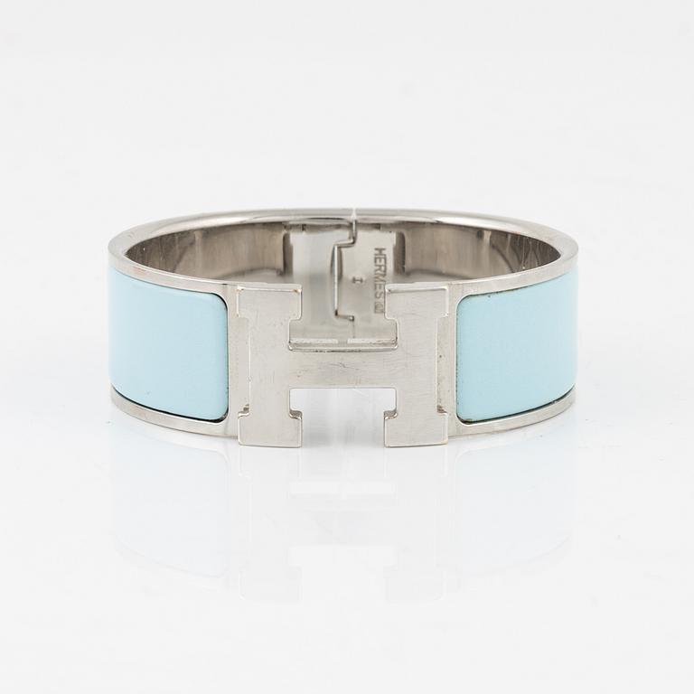 Hermès, a 'Clic Clac H' bracelet.