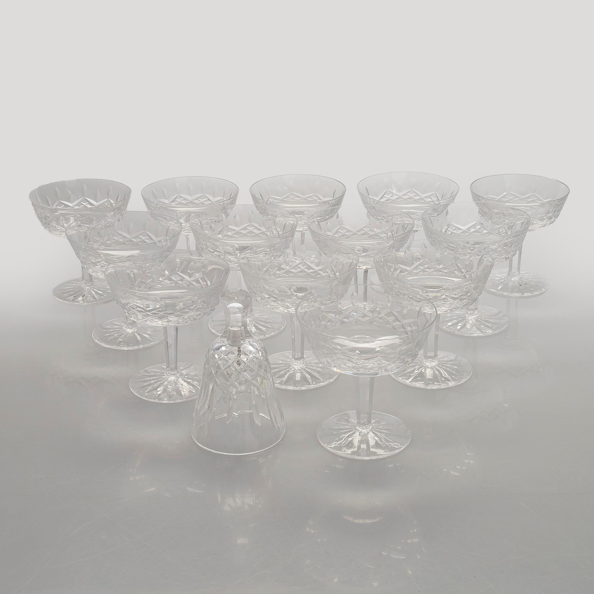 A set of 13 dessert bowls / champagne glasses, Waterford. and a table clock.