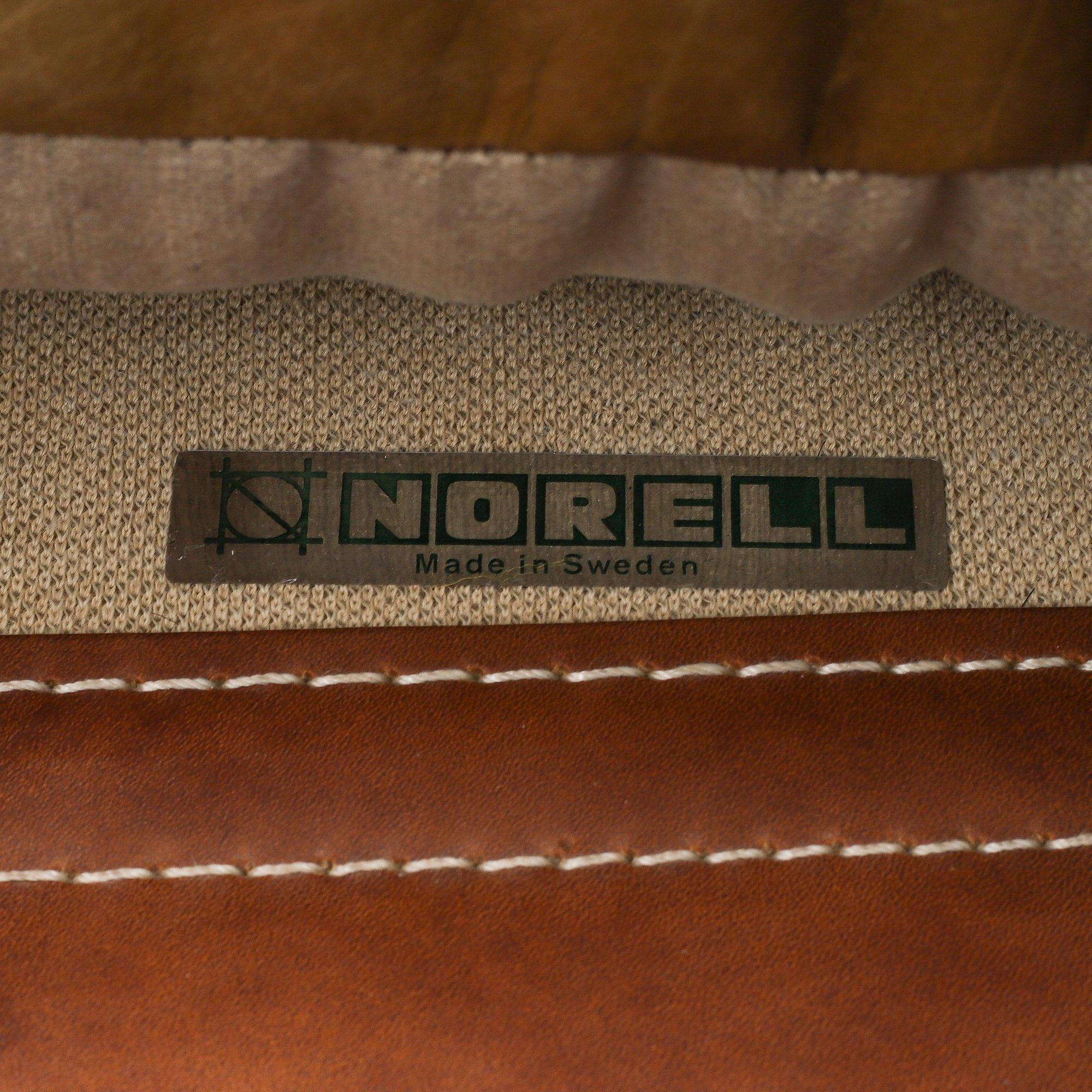 AN ARNE NORELL "INCA" LOUNGE CHAIR.