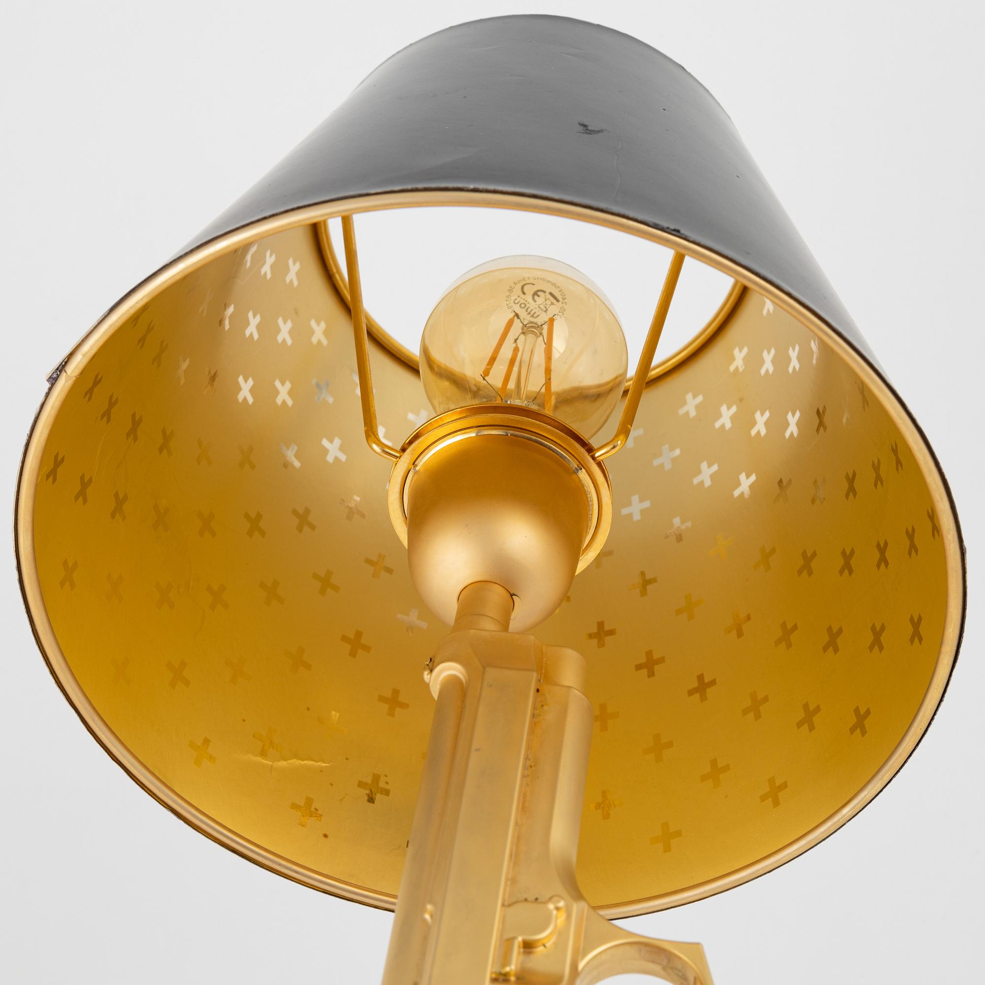 Philippe Starck, a 'Gun bedside Lamp' table light, Flos, Italy.