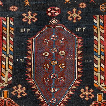 A Caucasian, antique rug, c. 225 x 125 cm.