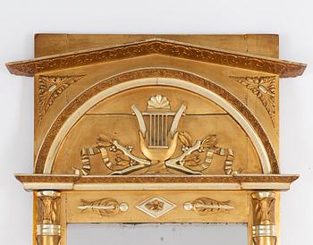 An Empire mirror, first half of the 19th century.