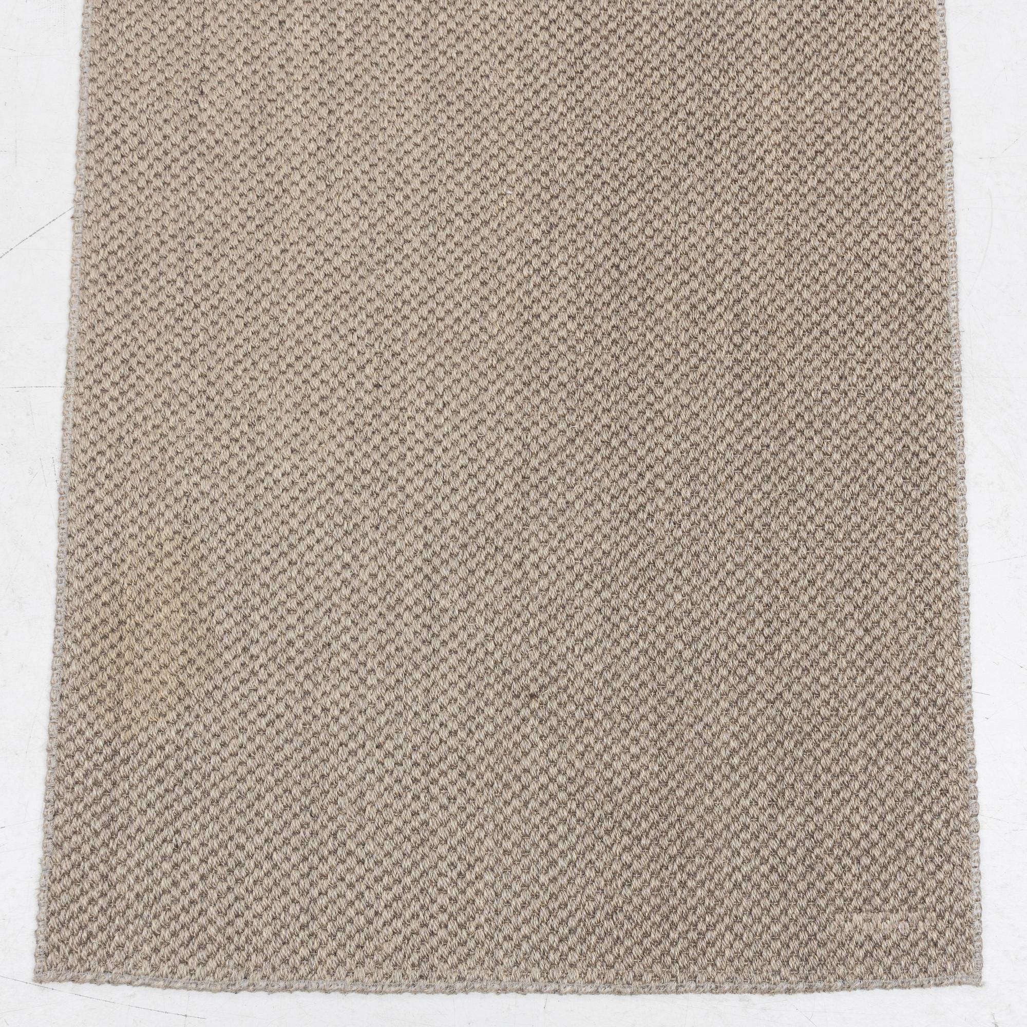 A runner carpet from NTK Atelier, Sweden, c. 448 x 87 cm.