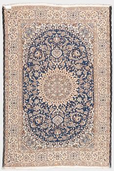 A carpet, Nain, part silk, ca. 295 x 201 cm.