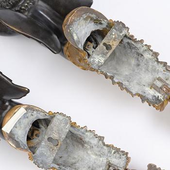 A pair of Napoleon III five-branch gilt and patinated bronze appliques.