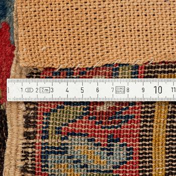 An antique Karabagh carpet,  ca 330 x 157 cm (one end with 1-3 cm flat weave).