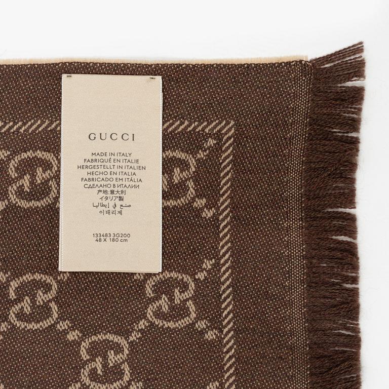 Gucci, a wool 'GG Jaquard Knitted Scarf'.