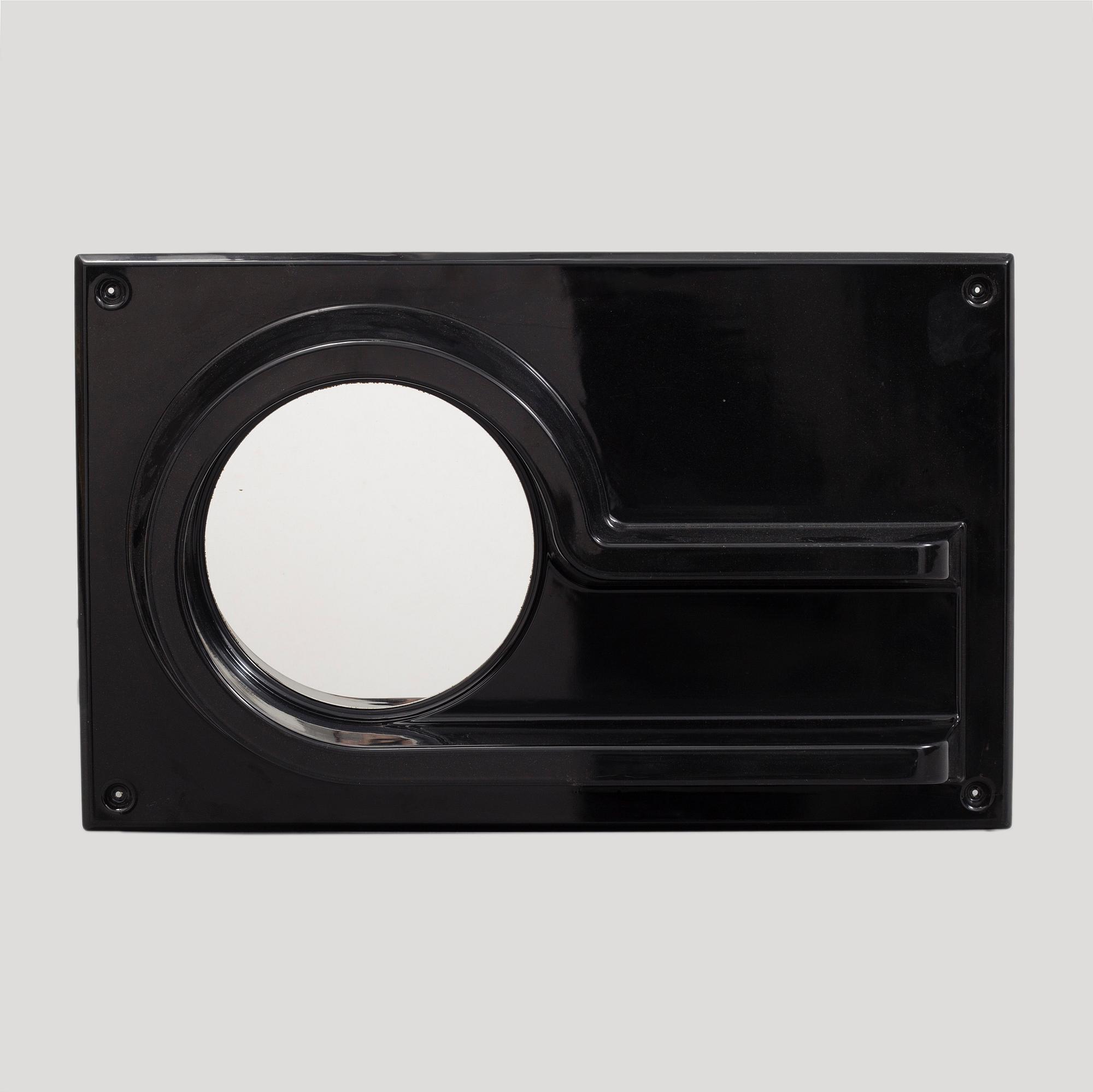 A 1970s plastic mirror by IKEA.