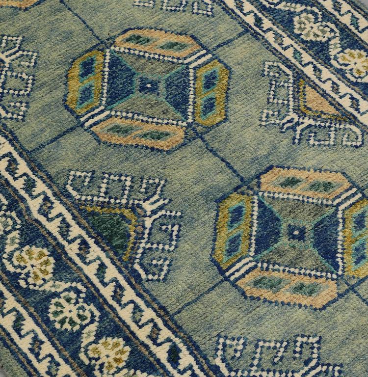 An Oriental runner, c. 296 x 77 cm.