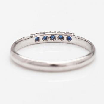 A 14K white gold ring with sapphires.