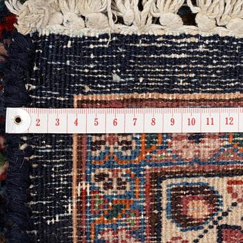 A Mashad carpet, signed, c. 289 x 198 cm.