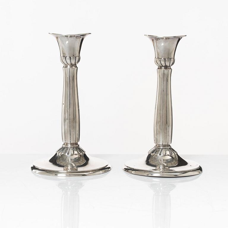 A pair of silver candle sticks, first half of the 20th century.