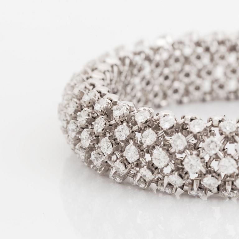 A platinum bracelet set with round brilliant-cut diamonds.