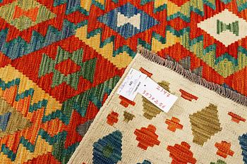 A kilim carpet, c. 303 x 256 cm.