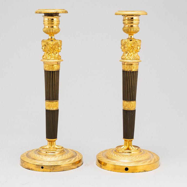 A pair of French Empire candlesticks, early 19th century.