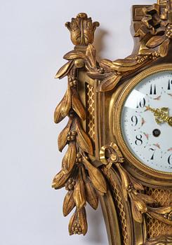 A French  Louis XVI-style wall clock, around 1900.