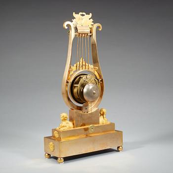 A late Gustavian early 19th century gilt bronze mantel clock.