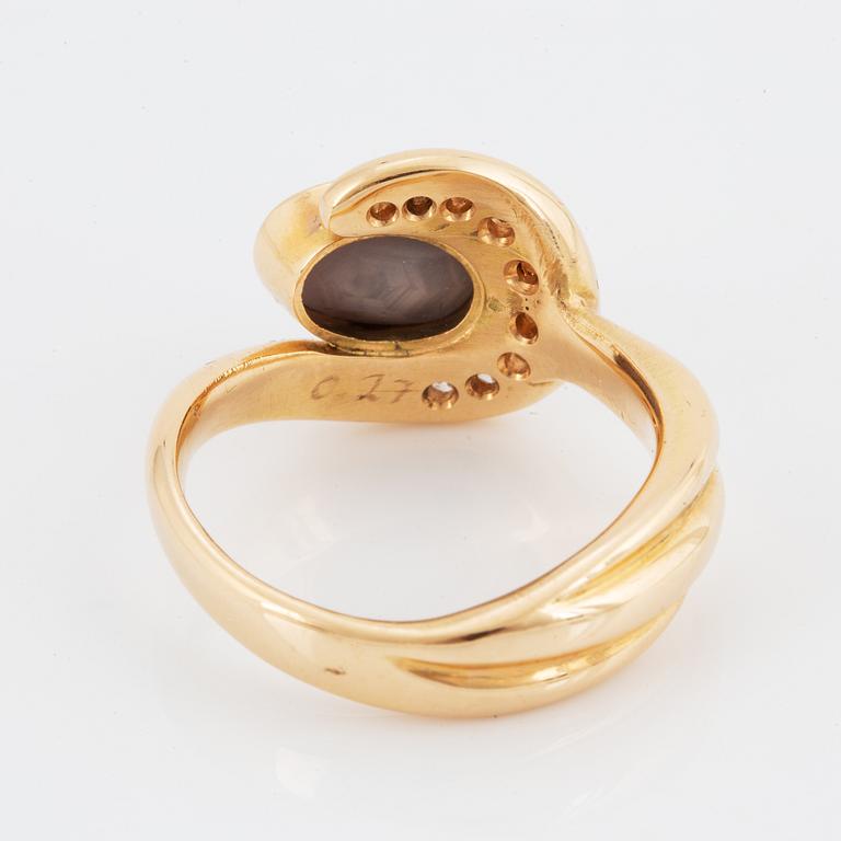 OLLE OHLSSON, 18K gold ring with star sapphire and diamonds.