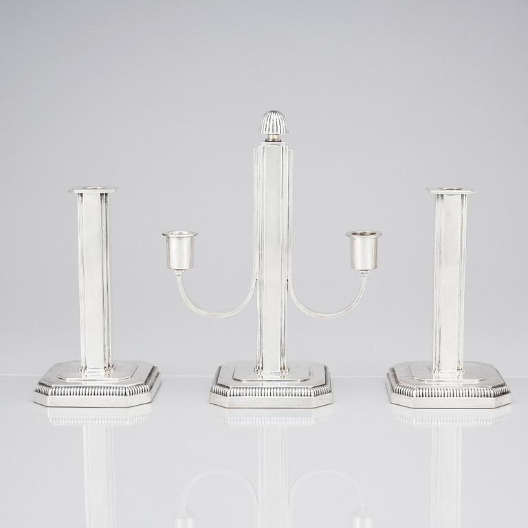 W.A. Bolin, a pair of silver candlesticks and a candelabrum, Stockholm 1953.