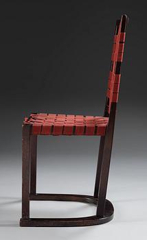 An Axel-Einar Hjorth black stained birch 'Futurum' chair with red girths by NK, Sweden,