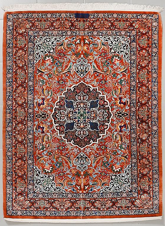 A Ghom rug, silk, signed, ca 144 x 102 cm.