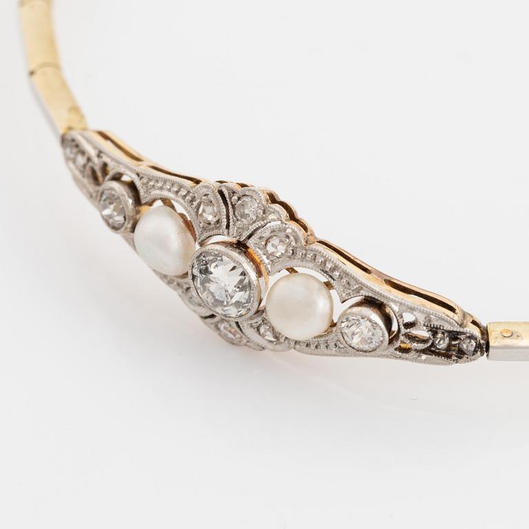 A 14K gold and platinum bracelet set with old- and rose-cut diamonds and pearls.