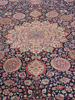 A CARPET. A semi-antique Kerman. 614,5 x 360,5 cm.