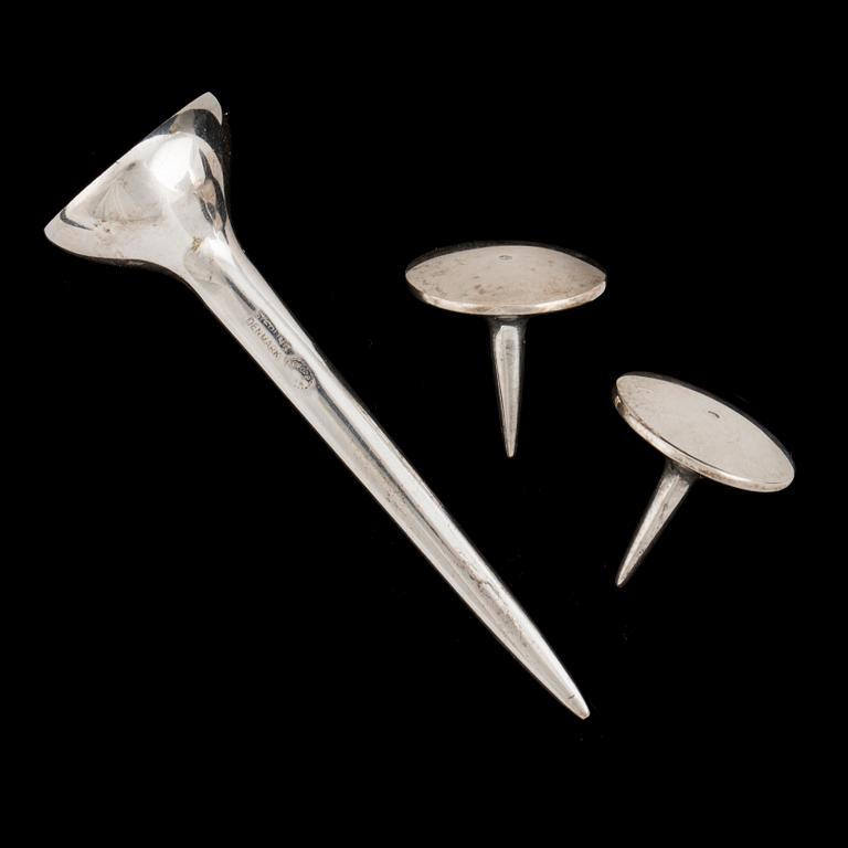 A silver Golf point, a box and two ball markers by Georg Jensen.