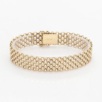 A 14K gold X-link bracelet, likely Norway.