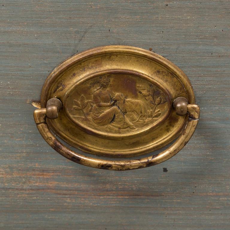 a chest of drawers from the first half of the 19th century.