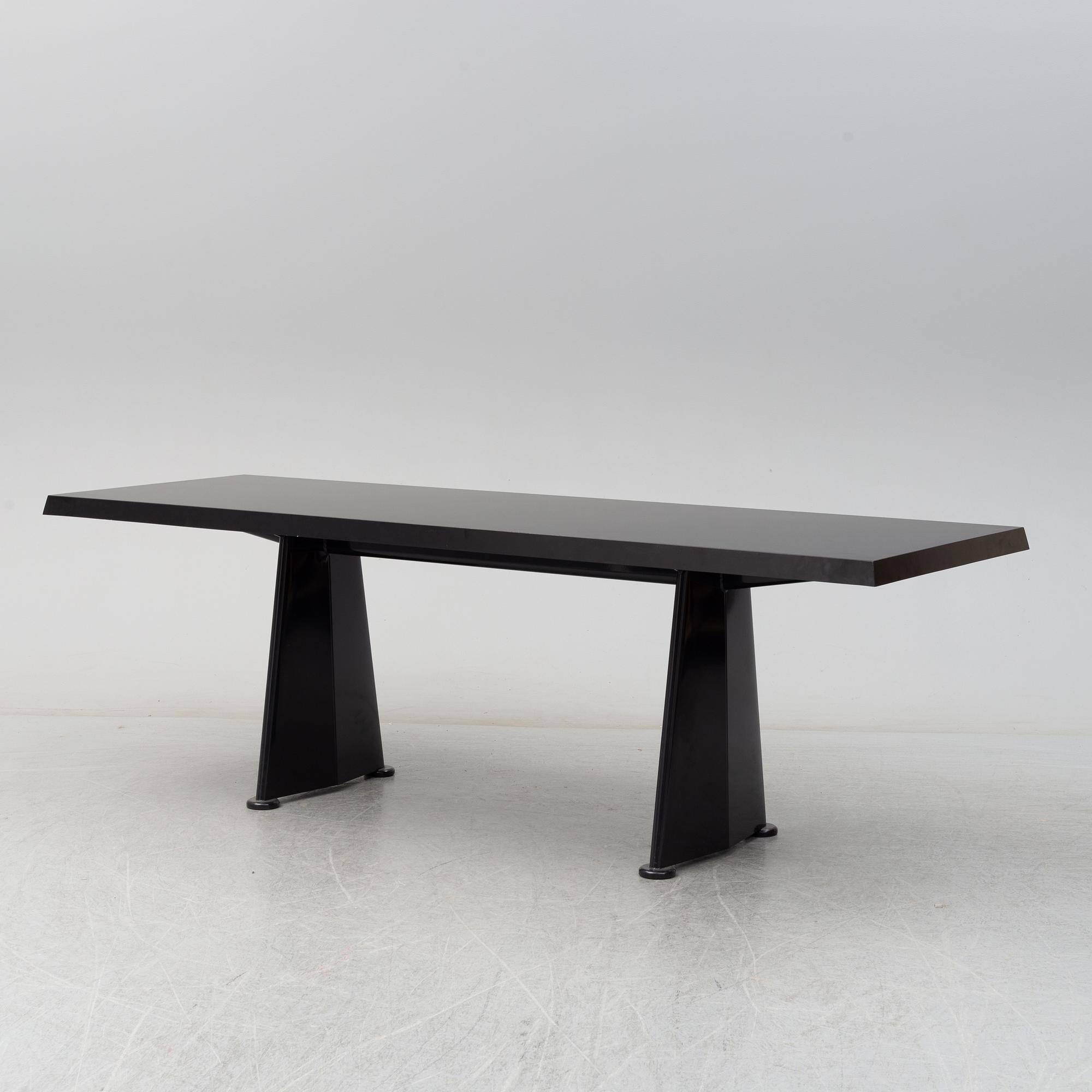 A 'Trapeze' dinner table by Jean Prouvé, Vitra, 2002.