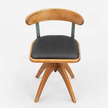 A 1920's swivel desk chair.
