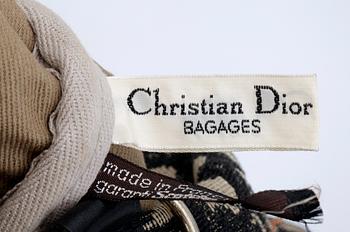 A monogram canvas bag by Christian Dior.