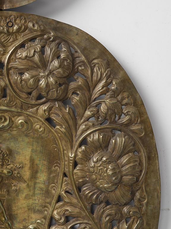 A set of four Swedish Baroque repoussé silvered brass reflector one-branch reflector plates, ca 1690-1700.
