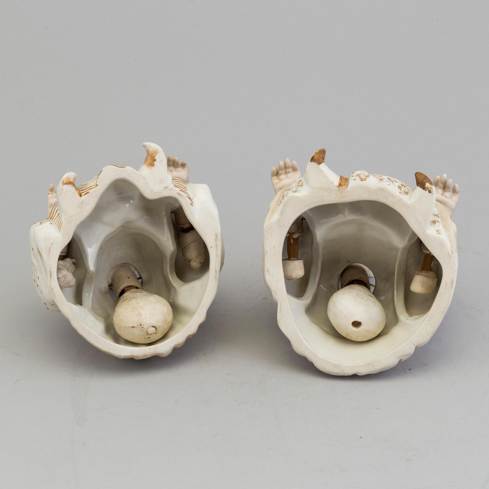 A pair of Chinese style 20th century porcelain nodding figures.