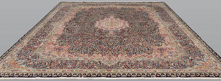 A Kirman Lavar carpet, 'Millefleur', approx. 383 x 300 cm.